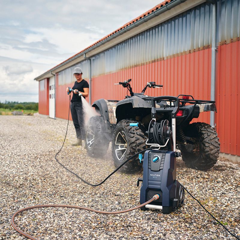 Nilfisk MC 2C 120520 XT AU Compact Cold Water Electric Pressure Water Being Used on Quad Bike