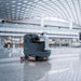 Nilfisk SC5000 Ride On Scrubber In Airport