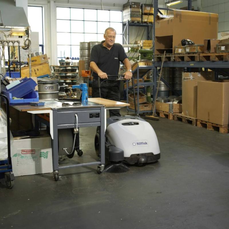 Nilfisk SW750 Mid Sized Walk Behind Sweeper Used By Man