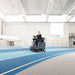 Nilfisk BR755 Ride On Scrubber In Gymnasium