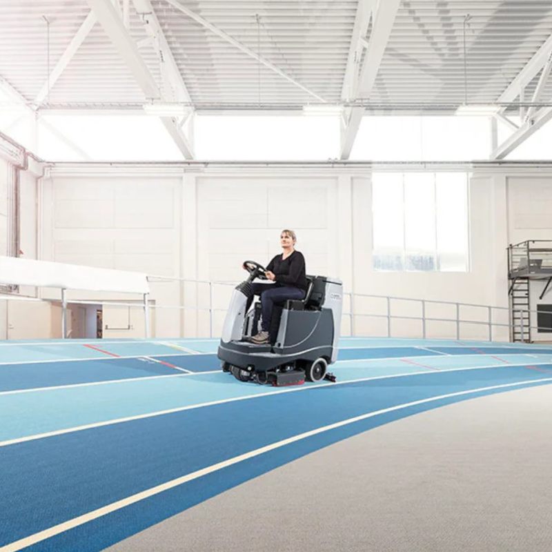 Nilfisk BR755 Ride On Scrubber In Gymnasium