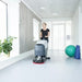 Nilfisk SC401 Mid Sized Walk Behind Scrubber Dryer Woman In Fitness Studio