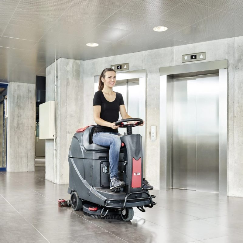 Viper AS530R 20 Batter Ride On Scrubber Next to Lift